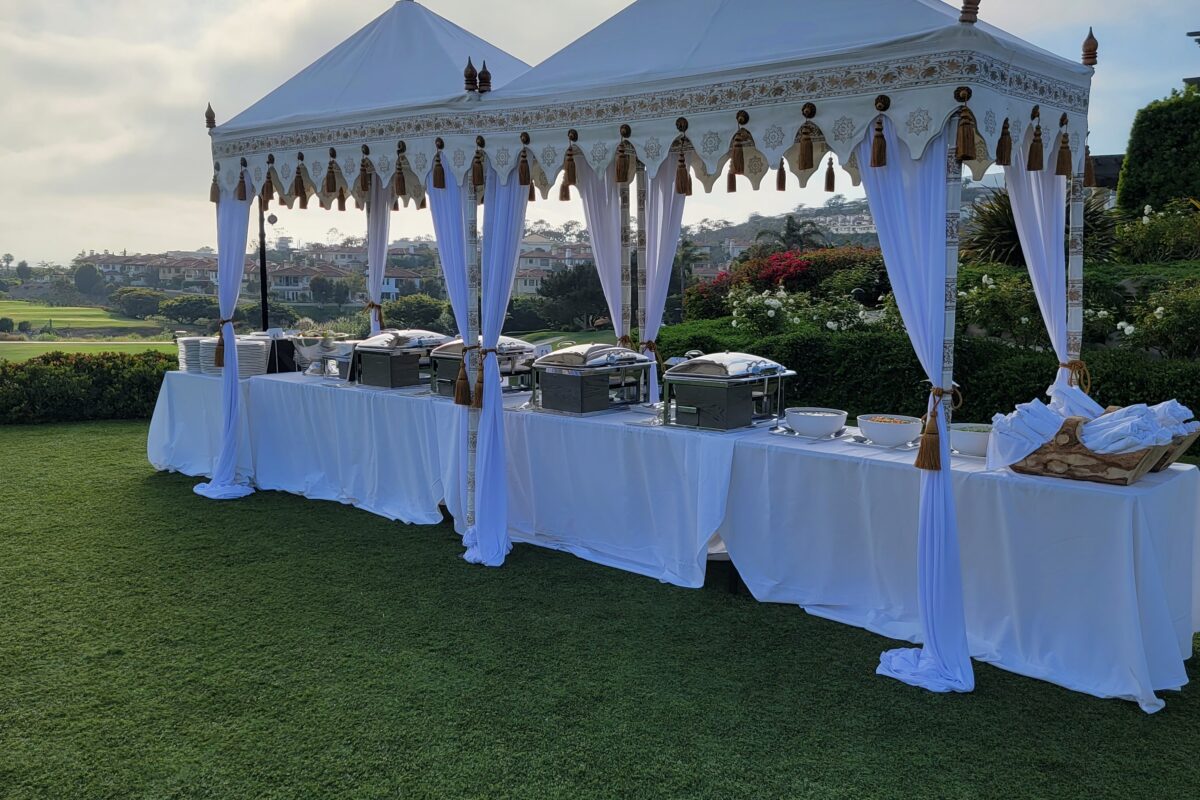 Mini Taj Tent set up as a decorated catering station at an outdoor event