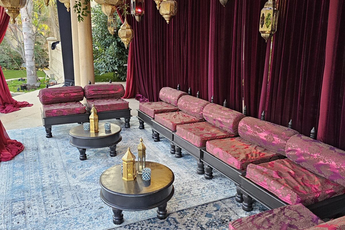 Royal Seating — low lounge furniture arranged with cushions and rugs