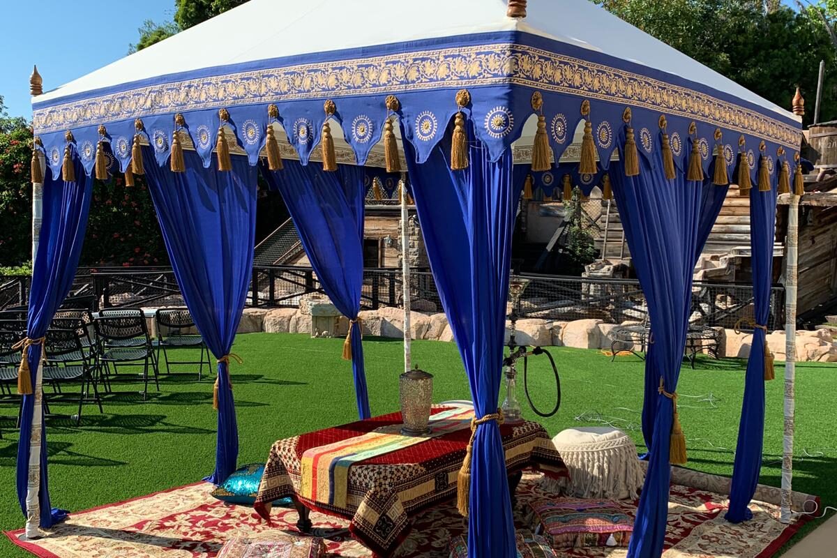 Raja Pergola Tent, a square draped pergola structure at an outdoor event